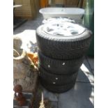 A set of 4 mangels, alloy wheels and tyres by Pirelli