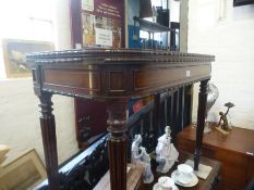 A Victorian rosewood foldover card table on fluted legs, 92cms