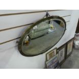 Oval brass mantle mirror