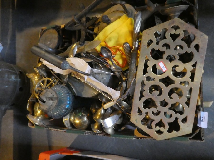 A box of brass items to include collector's spoons, pot stand, kettle, lamp, etc