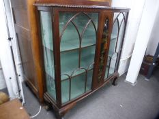 Early 20th century mahogany bow fronted display cabinet having laquered panel 121cm