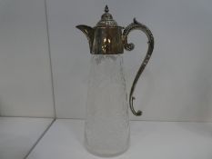 A large Victorian silver topped and handle Claret jug of high quality. A decorative piece with folia