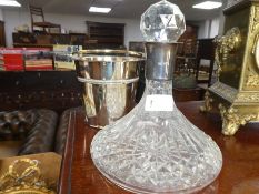 A Waterford crystal decanter having silver hallmarked collar, and a plated ice bucket