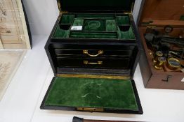 A late Victorian black leather jewellery box having fitted interior and Bramar lock