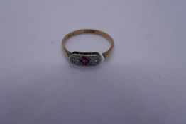 9ct and platinum Art Deco style ring set with central ruby flanked two small diamonds, '9ct and PLAT