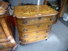 An antique Dutch marquetry bow fronted chest having 4 drawers
