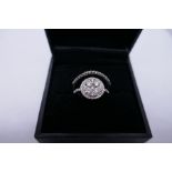 18K white gold diamond cluster ring with five central diamonds surrounded by a diamond halo, and sma