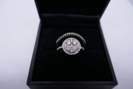 18K white gold diamond cluster ring with five central diamonds surrounded by a diamond halo, and sma