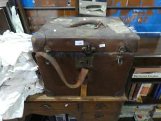 A chest containing vintage dolls and clothing, bags and vintage white jackets, etc