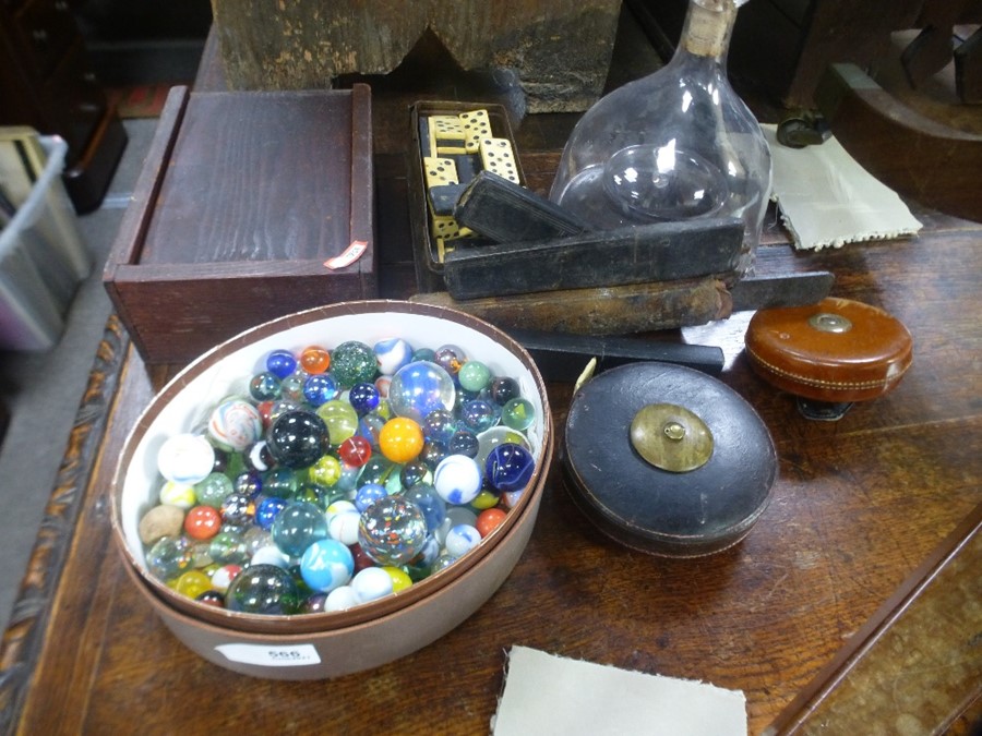 A mixed lot including Marbles, an antique fly catcher and dominoes