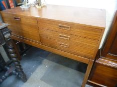 A 1970s sideboard having three drawers with cupboard, 120cms