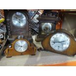 Four different style wooden mantle clocks, one with ornate brass face AF