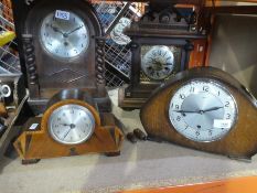Four different style wooden mantle clocks, one with ornate brass face AF