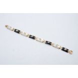 9ct gold onyx and mother of pearl set oriental bracelet 11.5g
