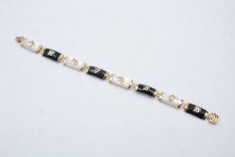 9ct gold onyx and mother of pearl set oriental bracelet 11.5g