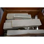 A box of silver plated items and a small suitcase of cutlery