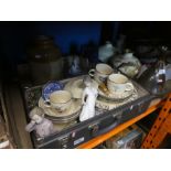 Two wooden crates containing vintage glass bottles and china, suitcase of chinaware, stoneware, etc