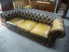 A pair of modern leather Chesterfield sofas by Thomas Lloyd, each 200cms