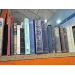 Shelf of mostly hardback books on various themes
