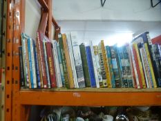 A full shelf of hardback books on steam engines and children's annuals, etc