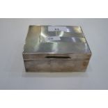 A silver patterned cigarette box 11cm x 9cm x 5cm, hallmarked London 1929 Cornelius Desormeaux Saund