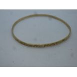 9ct yellow gold bangle with Starburst decoration, marked 375, 6.2g approx, 6.5cm diameter