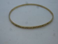 9ct yellow gold bangle with Starburst decoration, marked 375, 6.2g approx, 6.5cm diameter