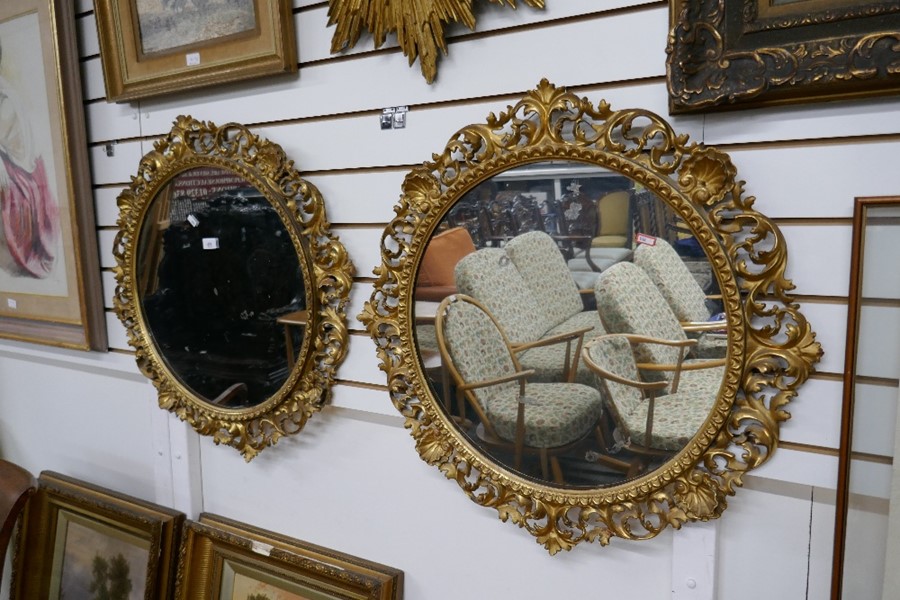 A pair of 19th century carved Florentine circular mirrors, each 73cm