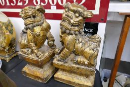 A pair of carved wood gilded Dogs of Fo, 46cm