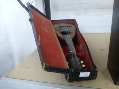 An old mandolin in fitted case