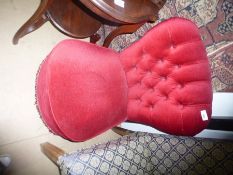 A red button back bedroom chair