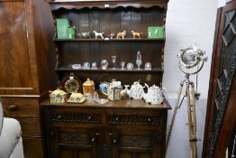 Reproduction oak dresser with rack back, having carved decoration, 125cm