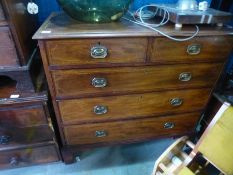 An antique mahogany cross banded chest of drawers and a two tier table
