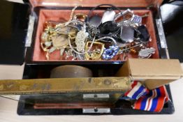 An oriental jewellery box containing costume jewellery, World War II medals, a hand painted clock et