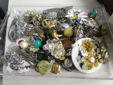 A tray of costume jewellery containing silver and marcasite earrings, pendants, brooches, rings, etc