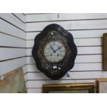 French wall clock having enamel dial in shaped ebony surround, with mother of pearl decoration, 61cm