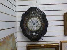 French wall clock having enamel dial in shaped ebony surround, with mother of pearl decoration, 61cm