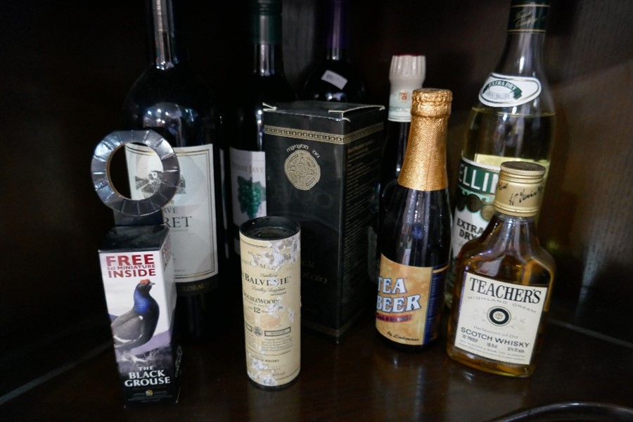 A quantity of alcoholic drinks including Whiskey and Martini