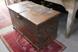 A wooden trunk having iron strapping and side handles, 87 cm