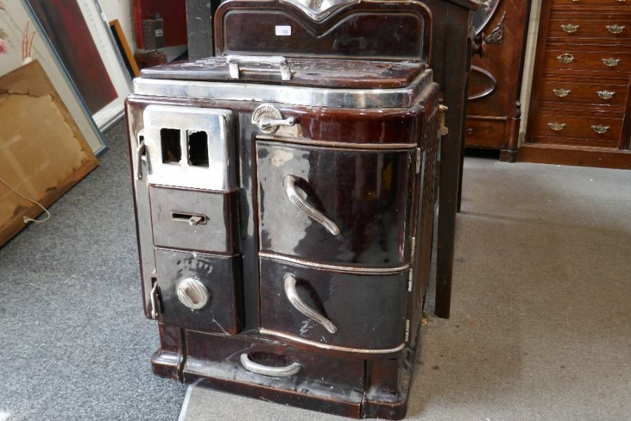 An old brown enamelled cast iron croissant stove, probably 1950s bearing initials PV, 51cm - Image 2 of 10