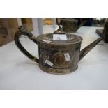 A large oval shaped Victorian silver teapot with decorative floriated design and beaded rim. With a