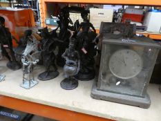 A large selection of tribal figures metal ethnic figures from around the World and a brass clock