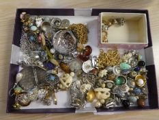 A tray of mixed costume jewellery to include silver earrings, brooches, three pairs of gold earrings