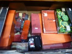 A box of various vintage toys to include tin plate examples of tractors and planes
