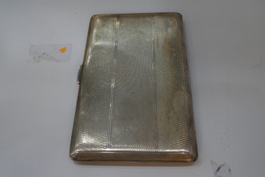A large heavy silver cigarette case with gilt interior and engine turned exterior, Chester 1946, Don - Image 3 of 6