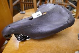 An old leather Imperial bicycle saddle, probably by Brooks, having embossed decoration