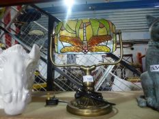 Tiffany style lamp depicting a dragon fly and two animal ornaments
