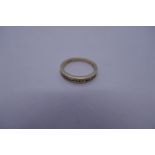 9ct yellow gold channel set diamond band ring, size O, 2.6g, marked 375