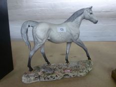 A Beswick matt grey dappled horse on shaped base