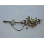9ct floral design brooch inset with seed pearls, marked 9ct, together with unmarked yellow metal bar
